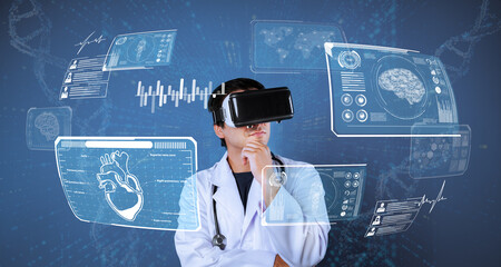 Doctor looking at medical data while diagnosis patient symptom by using artificial intelligence and augmented reality technology. Smart healthcare working wearing visual reality goggle. Ingenuity.