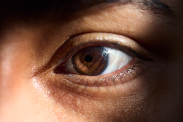 Macro latin woman eye, with sunlight