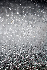 CLose Up of Condensation Bubbles and Marks on A Window Water Background