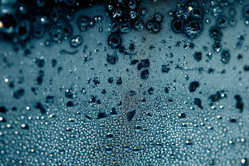 CLose Up of Condensation Bubbles and Marks on A Window Water Background