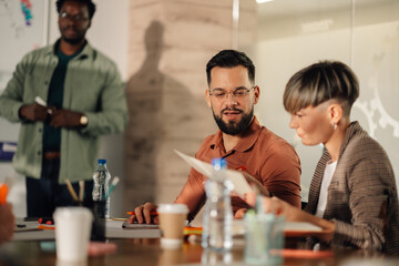 Business people collaborating on project during office meeting