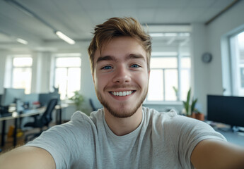 Young man smiling in modern office