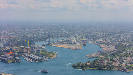 Aerial View of Sydney Harbour Balmain Darling harbour Sydney CBD cockle Bay Wharf North Sydney harbour bridge Lavender Bay Milsons Point Manly on a warm summer day blue skies 
