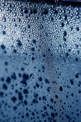 CLose Up of Condensation Bubbles and Marks on A Window Water Background