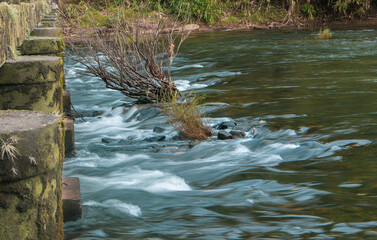 water flowing over the river