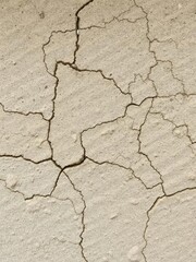 Fototapeta premium Rough and weathered stone texture with natural cracks and imperfections, perfect for backgrounds and design projects, cracks, stone