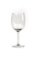 A wine glass is sitting on a white background. The glass is clear and has a stem. Concept of elegance and sophistication, as wine glasses are often associated with fine dining and special occasions