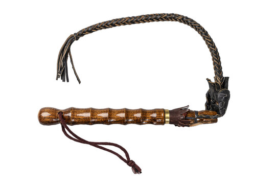 A wooden whip stick with a rope tied to it. The rope is frayed and the stick is brown