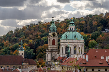 Prague's historical architecture, with the St Nicholas' baroque church towers and dome at Mala strana, offering a glimpse into the city's past.