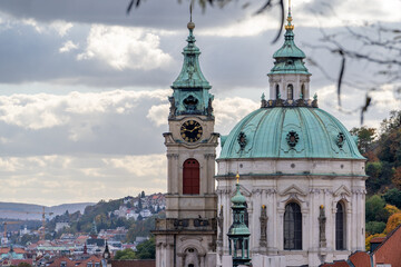 Prague's historical architecture, with the St Nicholas' baroque church towers and dome at Mala strana, offering a glimpse into the city's past.