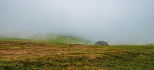 Fog on the Seiser Alm in the Dolomites in South Tyrol, Italy.