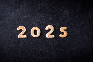 Festive New Year cookies in shape of 2025