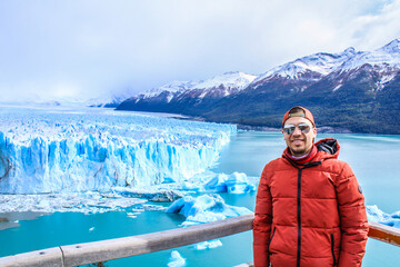 Tourists enjoying the views of the Perito Moreno Glacier, a giant glacier at the end of the world,...