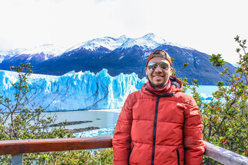 Tourists enjoying the views of the Perito Moreno Glacier, a giant glacier at the end of the world,...