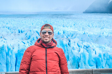 Tourists enjoying the views of the Perito Moreno Glacier, a giant glacier at the end of the world,...