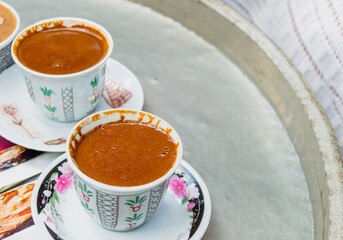 Traditional delicious Turkish coffee in Koza Han, Bursa, Turkey. Copy Space.  © Emine