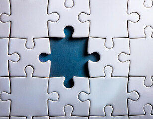 Puzzle with one missing piece being placed, representing leadership completing the bigger picture