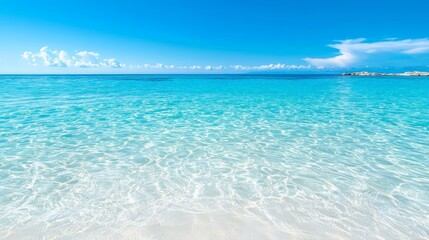 Obraz premium Stunning beach with crystal clear water and vibrant blue sky perfect tropical getaway