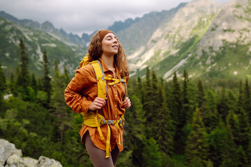 A young traveler travels along mountain paths. Hiking. Adventure, travel concept.