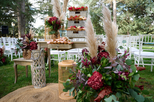 Elegant outdoor wedding decor with floral and rustic elements