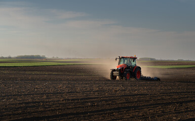 Tractor preparing the land for a new crop planting