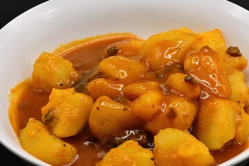 Cooked potatoes with mushroom gravy