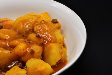 Cooked potatoes with mushroom gravy