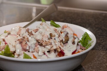 A healthy salad with fish.