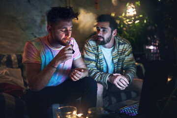Friends, smoking and men with weed in home for habit, cannabis and drugs at night. Smoker,...
