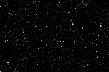 Realistic snowflake snow overlay effect on the black background.