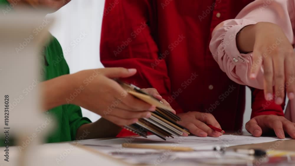 Poster slow motion hand closeup of professional architect and interior designer presenting material and col