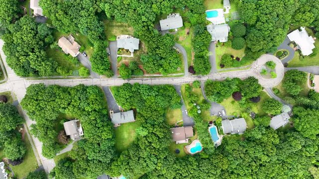 Aerial view of Suburban neighborhood in Sharon, Norfolk County, Massachusetts, with green forest and big villa.