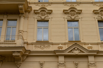 This is a structure that features numerous windows, along with a spacious balcony that enhances its aesthetic appeal and functionality