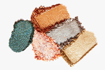 Bronze and beige eyeshadow texture swipe on a light white background. Cosmetic product.