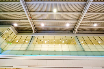 ceiling with lights at airport and glass wall