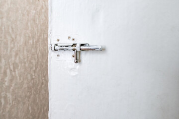 latch on the old painted white door