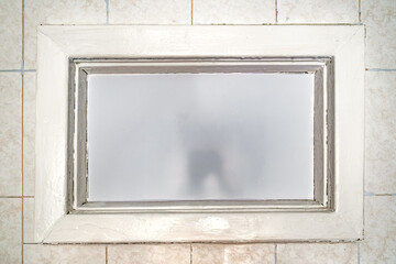 old interior window with frosted glass