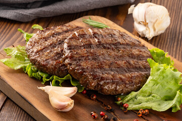 Patties cooked to become hamburgers or cheeseburgers