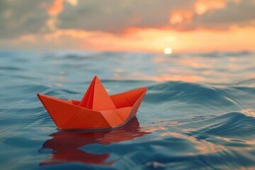 Origami paper boat floating in a sea