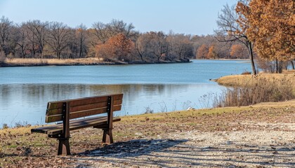 Serene autumn park scene featuring colorful trees, a tranquil pond, and cozy benches