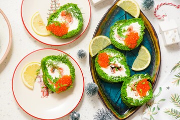 Spinach roll with cream cheese, salmon and red caviar