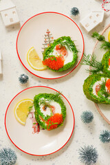 Spinach roll with cream cheese, salmon and red caviar