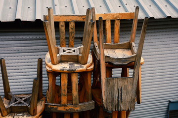 old wooden chairs turned upside down