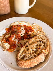 Breakfast plate with eggs and kimchi, and sourdough toast