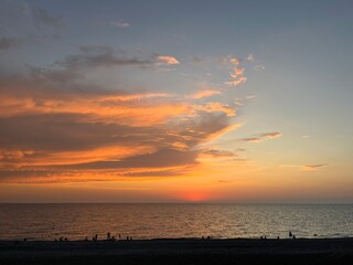 the sea wave rolls over the colorful pebbles on the Black Sea coast