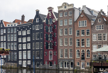  Typical gabled houses on Damrak district in  Amsterdam, Netherlands