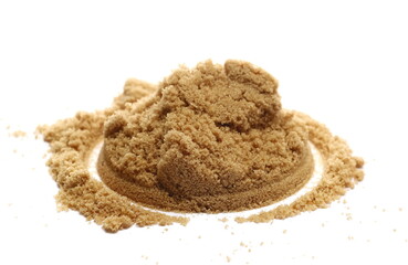 Pile brown unrefined sugar, muscovado isolated on white, side view
