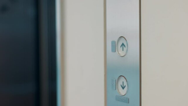 Elevator, building and hands of person with button to call lift for work, company and office floor. Professional, closeup and worker press up for travel, trip and arrival for career and job in Japan