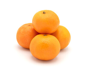 Stack of four fresh tangerines on white background