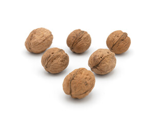 Walnuts spread on white background